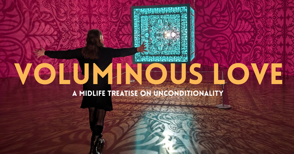 Voluminous Love is an essay by Seattle author Ariel Meadow Stallings. In this photo, the author stands in front of a large lighted piece of art, with her arms extended.

Voluminous Love describes a philosophical framework and spiritual practice that involves a daily practice of loving in non romantic ways and gently grieving. And then when romantic love presents itself, loving unconditionally with the understanding that grief will be part of that love. The reward? More love in your life, and more love with others.